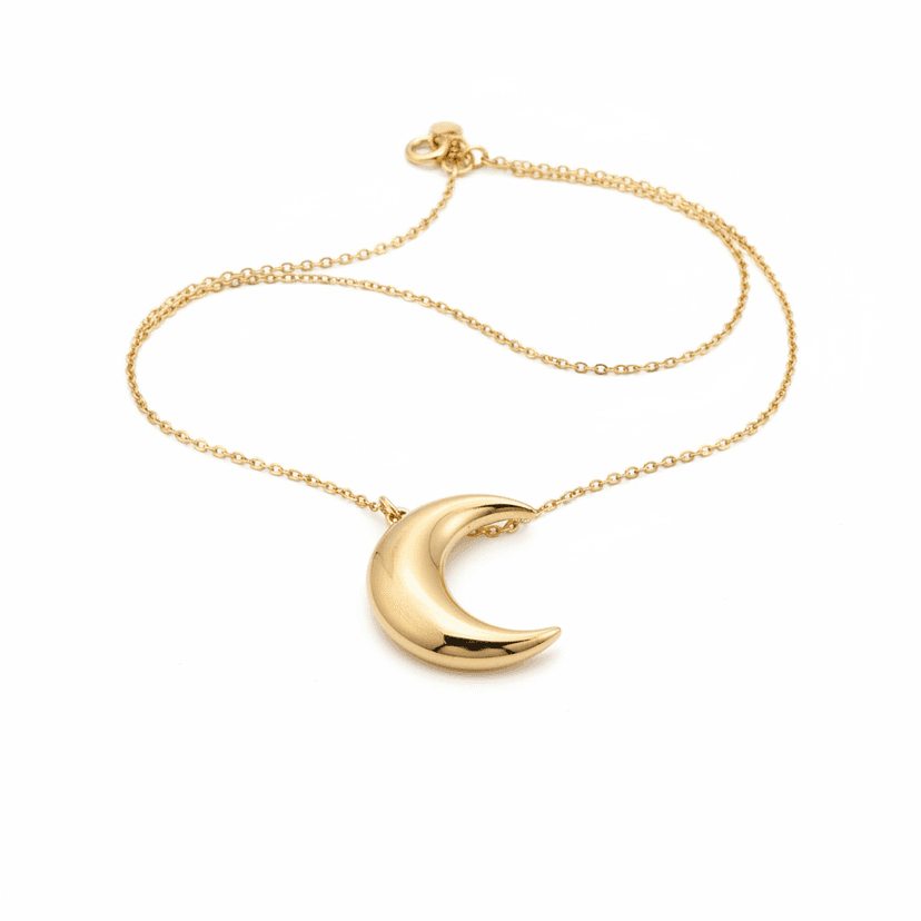 Dainty gold plated crescent moon pendant necklace on white background